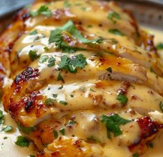 chicken covered in sauce and garnished with parsley