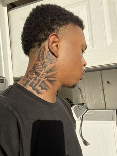 a man with a tattoo on his neck