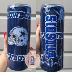 two women holding up blue tumblers with cowboys logos on them and one has a sticker in front of her