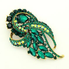 Gorgeous vibrant Emerald green rhinestone brooch jewelry, which can be used for your DIY project - Art Deco theme wedding, broach bouquet, bridal or bridesmaid dress accessory, ring pillow, cake and frame decorations, event decor, crafts, scrap booking, jewelry gift and much more. Size: 3 1/2 inch high 2 inches wide Stones color: Emerald green and AB (iridescent) Metal: Gold plated This rhinestone green brooch can be ordered with pin in the back to add to wedding gown or dress sash, to wire into Pillow Cake, Art Deco Emerald, Green Brooch, Bouquet Bridal, Diamond Paintings, Prom Ideas, Dress Sash, Brooch Bouquets, Ring Pillow