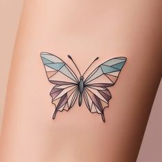 a small butterfly tattoo on the side of a woman's leg with geometric shapes