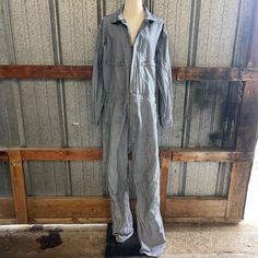 "^ Long Sleeve Railroad Stripe Blue & White Coveralls. This has zip front with snaps, zipper chest pockets, hip and back pockets with cargo loops.  Modern Size: L/XL Unisex Men's Size Label Vintage: no tag Content: 100%Cotton Label: Key ^ Please note specific garment measurements below: * measurements taken flat * Bust: 24\" armpit to armpit (48\" doubled) Sleeve: 23\"  Waist: 20\" Length: 61\" from HPS Rise: 14\" from crotch to top of waistband Inseam: 32\"  Leg Opening: 9.5\" * condition * Goo Utility Denim Overall With Cargo Pockets, Utility Denim Cargo Pocket Overalls, Utility Denim Jumpsuit With Pockets For Work, Utility Overalls With Patch Pockets And Bib Front, Utility Overalls With Patch Pockets, Fitted Utility Overalls With Pockets, Utility Denim Jumpsuit With Patch Pockets For Work, Fitted Overalls With Cargo Pockets, Utility Cotton Jumpsuit With Multiple Pockets