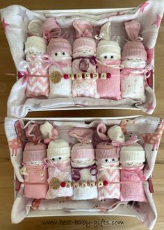 two baskets filled with baby items on top of a wooden floor