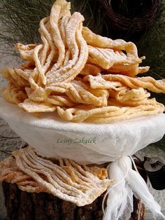 some kind of food sitting on top of a tree stump