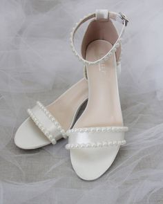 Shop our collection of women shoes for evenings and weddings in satin, lace, and glitter. Heels, flats, and dress sandals available for brides, bridesmaids and other special events. FREE SHIPPING IN U.S FOR ORDERS $100 AND MORE! Sandals With Pearls, Glitter Heels, Block Heel Sandals, Dress Sandals, Block Heels Sandal, Heel Sandals, Special Events, Wedding Shoe, Block Heels