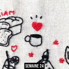 a piece of bread and some other items on a table cloth with the words semaine 24 written across it