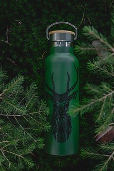 a green water bottle with a deer head on it