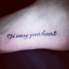 a small tattoo on the foot that says, i carry your heart