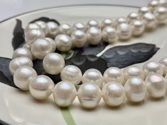 Material : Genuine Freshwater Pearl Length : 17.5/ 20 / 22 / 24 Inches Shape : Potato Bead Size: 11 mm Color : Natural White Shipping :We ship all orders within 24 hours from the U.S. (We closed on Saturday and Sunday) ** We Offer CUSTOM MADE SERVICES and WHOLESALE DISCOUNTS on LARGE QUANTITY PURCHASE. Please convo us on your requirements. We will be happy to create a private listing for you** As the variations in materials, there might be slight difference between the actual item and the pictur Pearl White Necklaces With 8mm Round Beads, Grey Pearl Necklace, Freshwater Pearl Necklace, White Freshwater Pearl, Seed Pearl, Freshwater Pearl Necklaces, Pearl Grey, Amethyst Gemstone, Natural Pearls