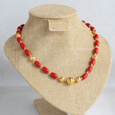 Crafted with coral-colored beads and gold-plated beads, this necklace boasts a handmade design, embodying a contemporary ethnic aesthetic. Vibrant and elegant, it radiates sophistication, seamlessly blending tradition and modern flair. Feel free to explore other options featuring coral and beads. As our exclusive design, we welcome customization requests--message us to make this piece uniquely yours. Length - 18 inch Beads Collection Gold, Coral Gold Necklace, Coral Chain Designs, Gold Beaded Necklaces With Red Coral, Gold Beads Beaded Necklaces For Festivals, Yellow Gold Beaded Necklaces With Colorful Beads, Coral Necklaces With Gold Beads For Gifts, Festive Gold Necklace With Colorful Beads, Festive Red Coral Necklace