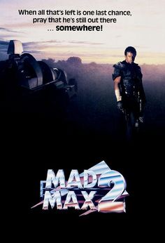 the movie poster for mad max 2 is shown in front of a man standing on top of