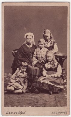 an old black and white photo of several children