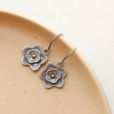 Delicate blossoms blooming in the desert sun. Beautifully stamped and layered cactus flowers finished with a touch of 14k gold. A delicate balance of rustic beauty and femininity. Measure just over 1". Handmade Shepherd hook earwires. Sterling silver, which has been oxidized and hand polished for an antique finish and 14k gold. Also available in all sterling silver. Your jewelry will arrive beautifully gift wrapped in a small box. Multiple items will be combined, unless separate boxes are reques Artisan Flower Earrings, Desert Sun, Mixed Metal Earrings, Brown Jewelry, Cactus Flowers, Stylish Earring, Cactus Flower, In The Desert, Metal Flowers