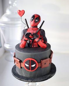 there is a cake with a deadpool on it