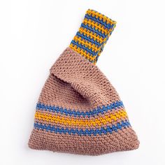 a crocheted neck tie is shown on a white surface with blue, yellow and orange stripes