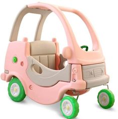 a pink toy car with green wheels on a white background