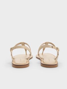 This product is made with at least 20% sustainable materials by weight. CHARLES & KEITH uses recycled, degradable, organic, and water-based materials in our eco-conscious collection. In the summer, elegant black sandals are always a classic choice, but for a refreshing twist, consider a pair in taupe instead. Taupe offers the same sophistication and versatility, as showcased in these thong sandals. The metallic gold accents infuse a touch of glamour, elevating the minimalist design with eye-catching flair. Plus, the padded thong straps ensure extra comfort. Belt Ring, Summer Elegant, Pu Heels, Charles Keith, Kids Sale, Metallic Accents, Thong Sandals, Metallic Gold, Gold Accents