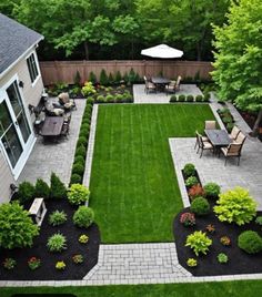 an aerial view of a backyard with lawns, landscaping and patio furniture in it