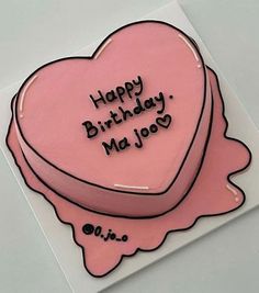 a pink heart shaped cake with the words happy birthday ma joso written on it