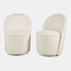 two white chairs sitting next to each other