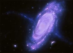 an image of a spiral galaxy in the sky