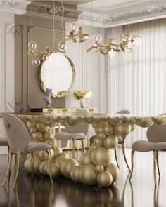 an elegant dining room with gold balloons on the table