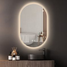 a bathroom with a round mirror on the wall