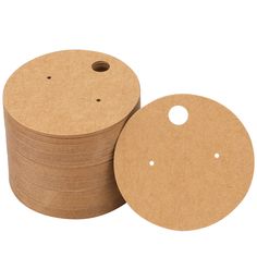 several round cardboard discs stacked on top of each other with holes in the middle and bottom