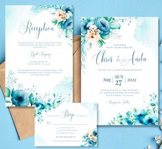 wedding stationery with blue flowers and greenery