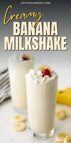 two glasses filled with banana milkshake on top of a table