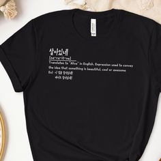 Elevate Your Style with Korean Phrases T Shirts 🌟 Discover the perfect fusion of fashion and Korean language with our Korean Phrases Hoodies! 🌟 At BusanKoreanMan Shop, we're dedicated to providing you with unique and stylish apparel that celebrates the allure of Korean culture. Our Hoodies feature trendy Hangul quotes and expressions, allowing you to make a fashion statement while expressing your love for the Korean language and culture. Key Features ★ Authentic Hangul Designs: Our Hoodies proudly display authentic Korean Hangul characters, capturing the elegance of the language in every design. ★ Trendy Phrases: Explore a wide range of trendy Korean phrases and expressions, perfect for K-pop and K-drama enthusiasts. ★ Premium Quality Comfort: Crafted from soft, breathable materials, our Kpop Style Letter Print Relaxed Fit Top, Kpop Style Tops With Letter Print In Relaxed Fit, Kpop Style Relaxed Fit Letter Print Tops, Kpop Style Relaxed Fit Tops With Letter Print, Black Top With Funny Text For Everyday, Black Kpop Tops With Screen Print, Trendy Black Shirt With Funny Text, Black Kpop Tops With Letter Print, Black Kpop Letter Print Top