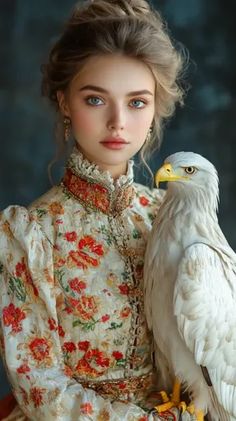 ↑↑↑ Larger size on website 🔸 A young woman with long blonde hair styled in an elaborate updo, wears a white, red, and gold floral Elaborate Updo, Parted Lips, White Eagle, Bright Blue Eyes, Rosy Cheeks, Long Blonde, Long Blonde Hair, Feminine Look, Gold Floral