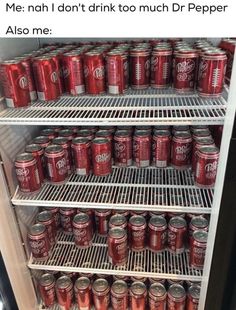 a refrigerator filled with lots of red sodas and cans next to eachother