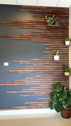 the wall is decorated with wooden planks and potted plants