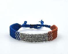 This boho and hippie style bracelet in denim blue and brown colours is comfortable to wear and lightweight around the wrist with adjustable sliding knot closure so fits most sizes both women, men and children. It compliments your casual outfit, also perfect as a gift. Lac plated stainless steel chain in silver colour added for a modern look. Woven length 14cm, extension braided length 9cm, width 1.2cm Designed and made in a smoke free - pet free environment.  All our products are nickel free and Sliding Knot Closure, Festival Accessories, Free Bracelet, Bohemian Bracelets, Bff Gifts, Friendship Gifts, Braided Bracelets, Hippie Style, Stainless Steel Chain