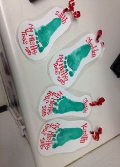 three stickers that say happy feet and have red bows on them, sitting on top of a refrigerator