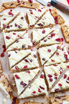 white chocolate and cranberry crackers are arranged on a cutting board