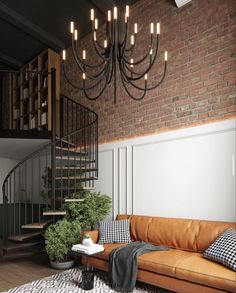 a living room filled with furniture and a spiral stair case next to a brick wall