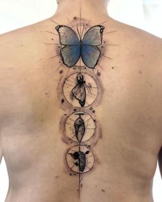 the back of a man's chest with three circles and a butterfly on it