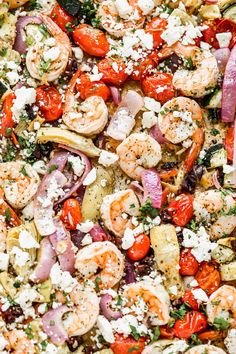 shrimp, tomato, and artichoke salad with feta cheese in a pan