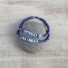 This bracelet by Peace J Designs is handcrafted with love and created with a word or words that are meaningful to you. Each bracelet is intended to be a fun reminder of people, places or words that bring you joy. They look really nice stacked together as multiple bracelets with varying words and colors. They also make great gifts for friends and family. This listing is for **one** DEEP PURPLE bracelet personalized for you with a word or words of your choice. Please indicate in the personalization section what word/words you would like on your bracelet as well as the symbols you would like to use (if any). See more listings in this shop for other colors. Handcrafted with: + 6/0 Glass Seed Beads + 4mm Crystal Bicone Beads + 5mm Acrylic Letter Beads (symbols vary in size) + Silver Colored Nic Handmade Inspirational Bracelets For Friendship, Handmade Inspirational Friendship Name Bracelet, Handmade Inspirational Friendship Bracelet, Inspirational Blue Beaded Bracelets For Gifts, Inspirational Blue Bracelets For Gifts, Inspirational Handmade Friendship Name Bracelet, Personalized Inspirational Blue Bracelets, Blue Inspirational Adjustable Beaded Bracelets, Inspirational Blue Adjustable Beaded Bracelets