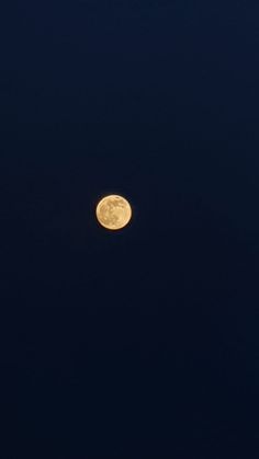 the full moon is shining brightly in the dark night sky with no clouds on it