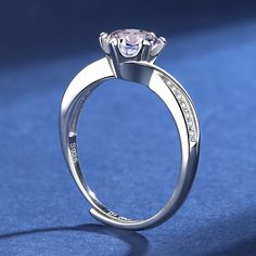 a diamond ring on a blue background