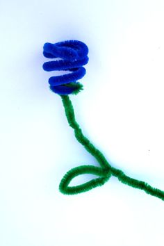 a blue flower with green stems on a white background, in the shape of a spiral