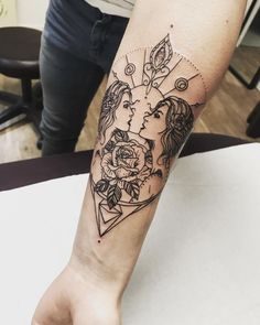 a woman's arm with a tattoo on it