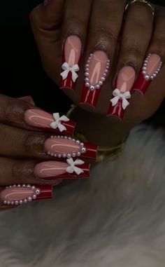 Looking for creative ideas to decorate your nails this holiday season? Simple Christmas nail art ideas are a great way to add a touch of Christmas charm to your look without overcomplicating things. These designs are meant to be simple, yet they capture the festive spirit beautifully.  You can try classic Christmas themes like candy cane stripes, snowflakes, or Christmas trees. A white base with blue snowflakes is elegant and easy to achieve. If you want something more traditional, alternate red Christmas Acrylic Nails Candy Canes, Christmas Nail Black Women, Nail Ideas Simple Christmas, Short Red Winter Nails, Nail Ideas Acrylic Baddie, Holiday Nails With Gems, Red And White French Tip Nails Christmas, Nails Christmas And New Years, Christmas Acrylic Toe Nails