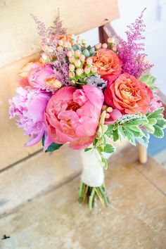 a vase filled with pink flowers on top of a table