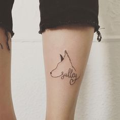 two people with tattoos on their legs and one has a dog's name tattooed on it