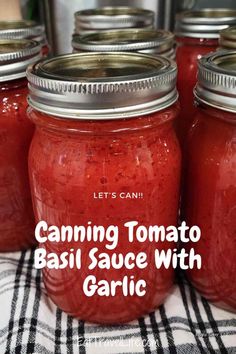 canning tomato basil sauce with garlic in mason jars on a checkered table cloth and text overlay that says canning tomato basil sauce with garlic