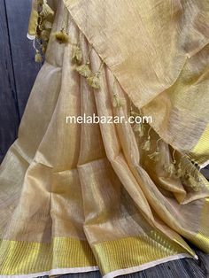 Gorgeous gold linen by tissue saree. Fall is attached by hand. Note: The color of the products may slightly vary according to the lighting conditions and the color calibration of the viewing LED devices. If you would like more clarity before your purchase, please drop us a message . Diwali Linen Dupatta, Festive Linen Dupatta With Zari Work, Festive Wedding Linen Saree, Linen Dupatta For Wedding And Festivals, Festive Linen Saree-shaped Dupatta, Linen Dupatta For Festivals, Festive Handloom Linen Dupatta, Gold Saree, Saree Beautiful